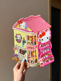 Hello Kitty Flower Shop – 3D Pixel House with Pink Roof, FLORA Sign & Tiered Plant Shelves