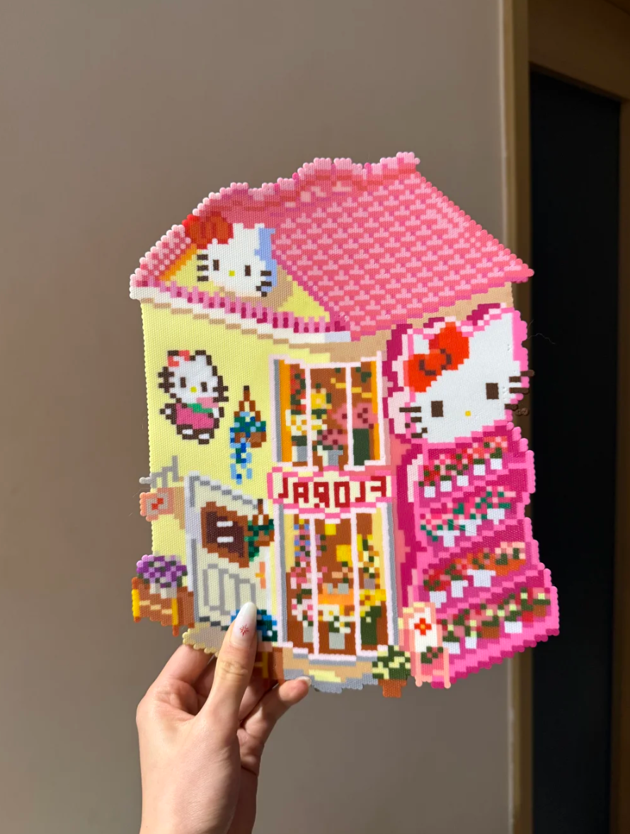 Hello Kitty Flower Shop – 3D Pixel House with Pink Roof, FLORA Sign & Tiered Plant Shelves