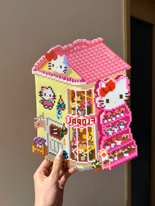 Hello Kitty Flower Shop – 3D Pixel House with Pink Roof, FLORA Sign & Tiered Plant Shelves