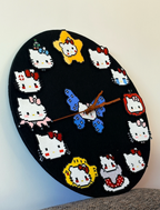 Hello Kitty Pixel Clock – 12 Unique Kitty Designs with Butterfly Centre – Pink DIY Wall Clock