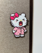Yawning Hello Kitty Pixel Charm – Sleepy Expression & Polka-Dot Pajamas – Playful Room Decor