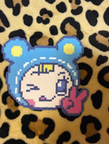 Winking Y2K Girl Pixel Charm – Purple Outline, Blue Hood & Peace Sign – Cute Character Decor